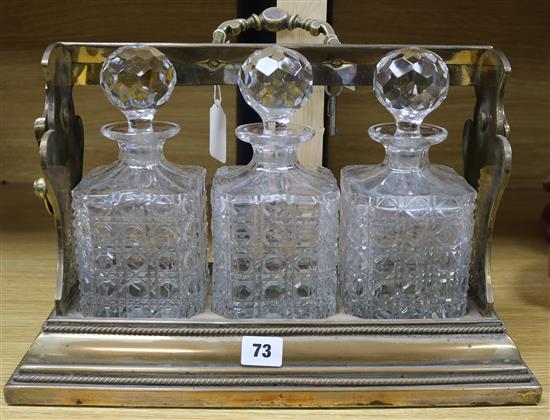 A Betjemanns Victorian three bottle tantalus with key